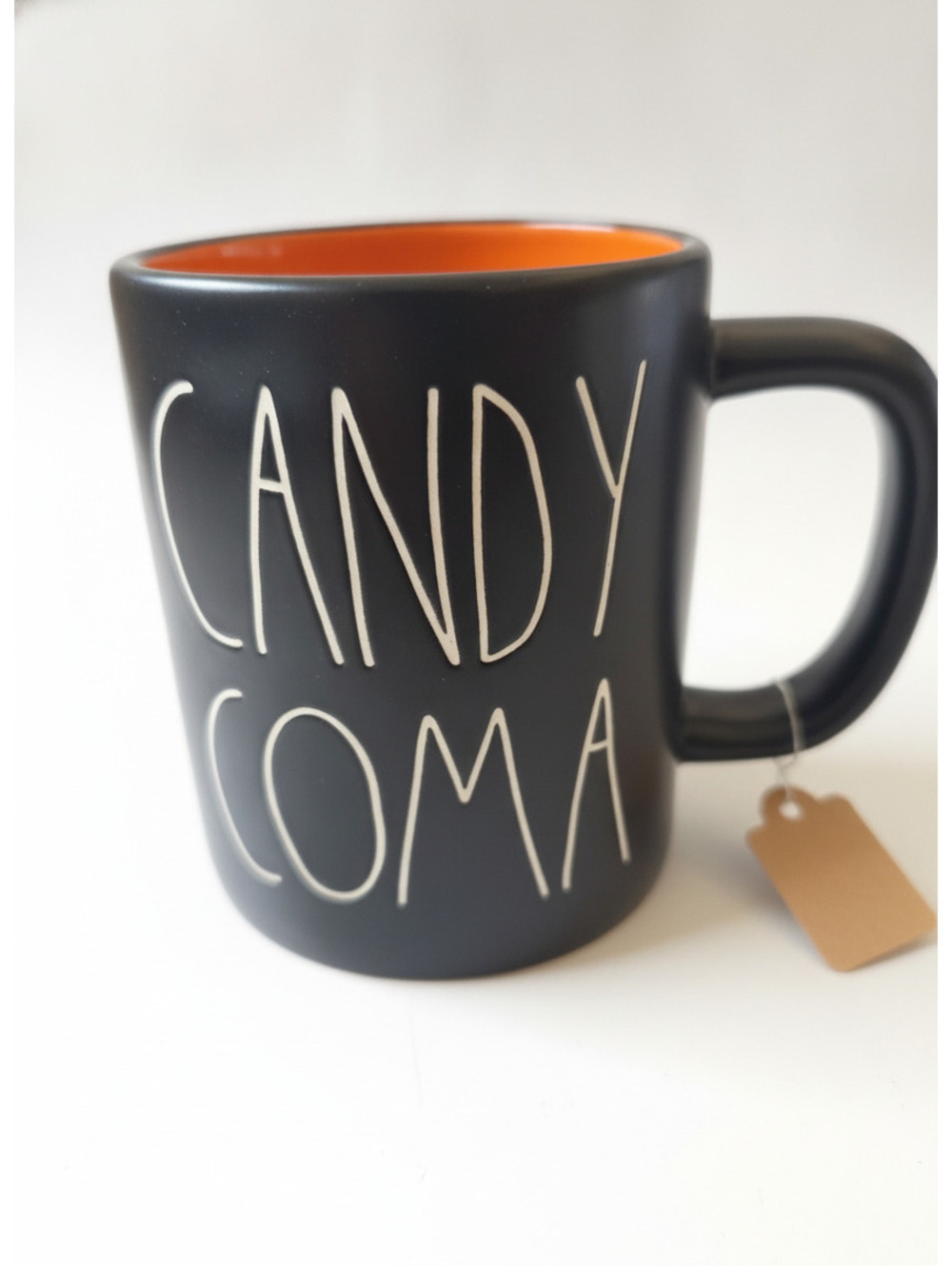 Rae Dunn Black and Orange Ceramic Coffee Mug with 'CANDY COMA' Text